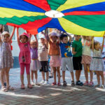 Children playing with a parachute in Moldova