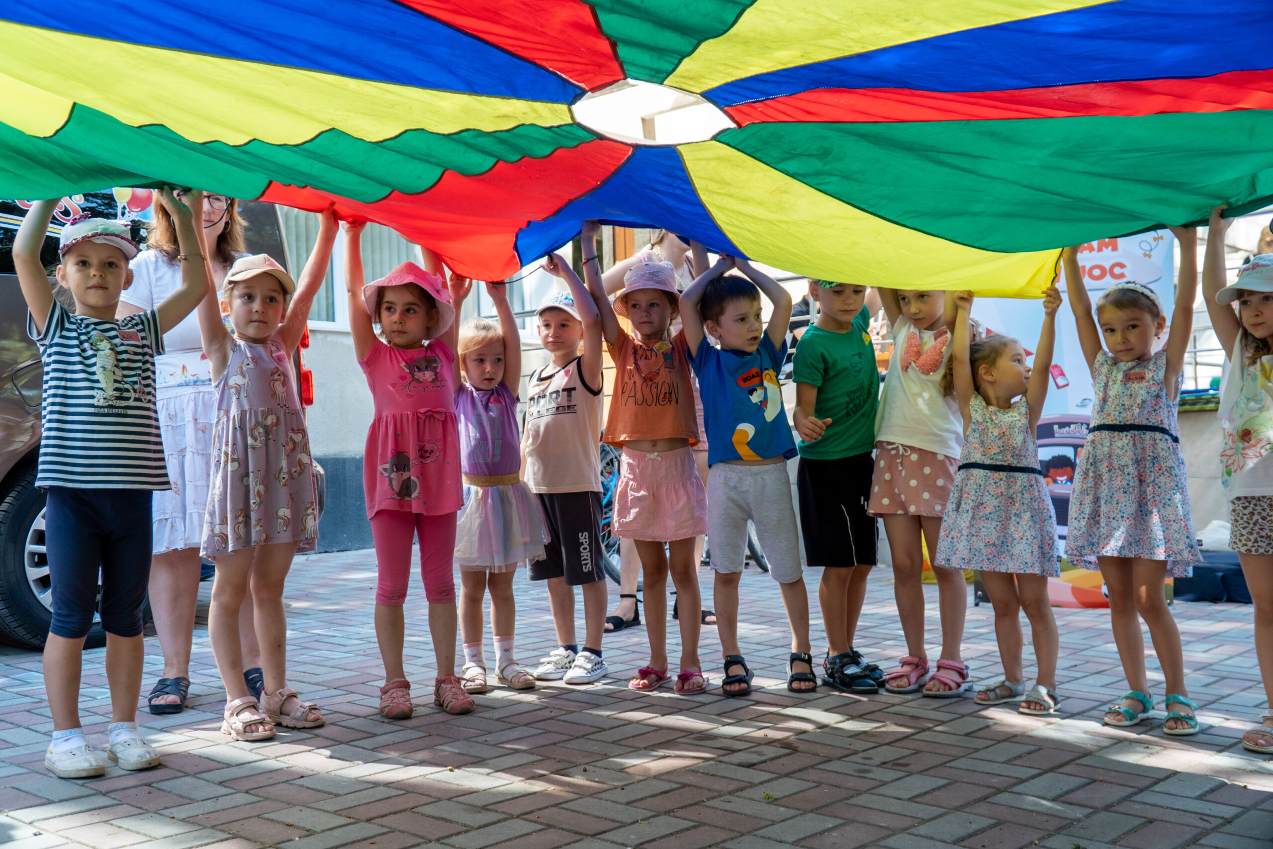 Children playing with a parachute in Moldova