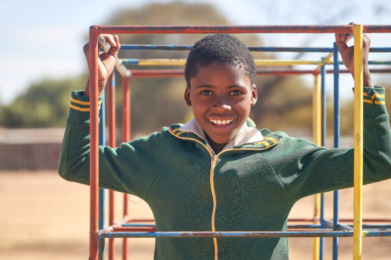 A girl on a playground in Zimbabwe