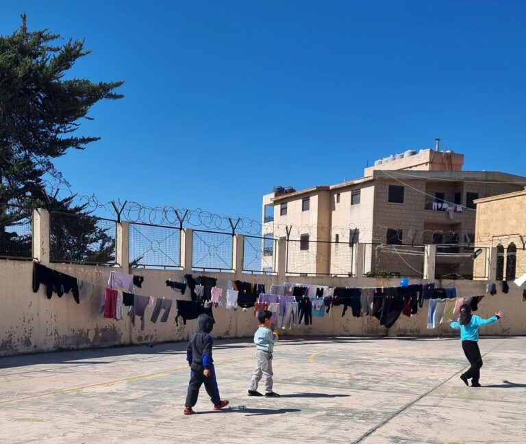 Children playing outside in a courtyard in Lebanon