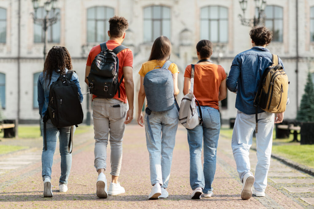 Group of students walking on campus.