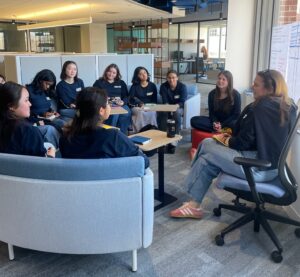 Shanna Marzilli sits with a group of youth advocates.