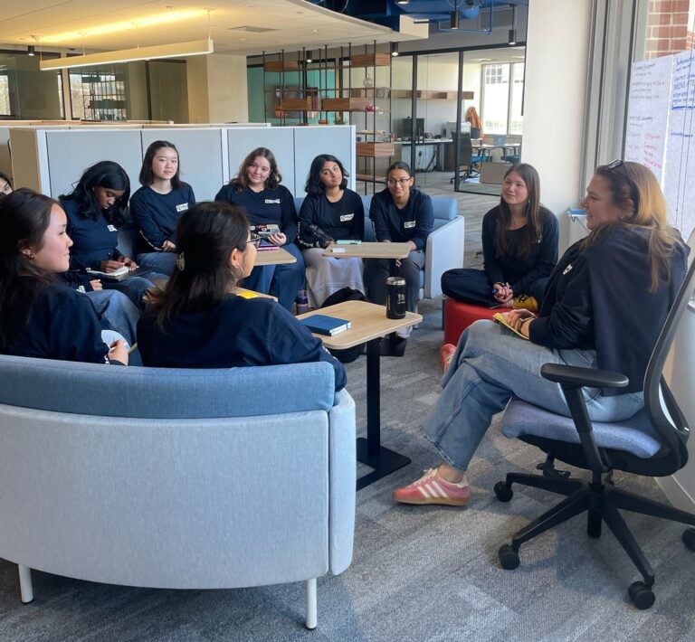 Shanna Marzilli sits with a group of youth advocates.