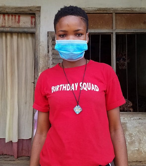 Sponsor Child with a mask on in Cameroon