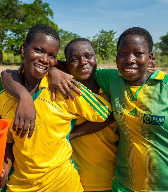 Girls apart of the Champions of Change project hugging
