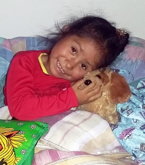 Sponsored girl in Bolivia with stuffed animal