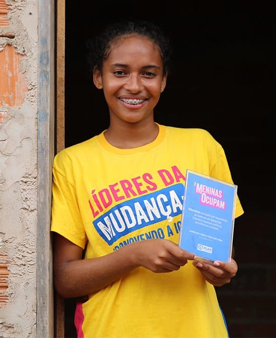 Sponsored Girl in Brazil Holding An Award