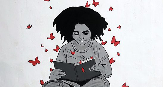 Illustration of a black girl reading a book