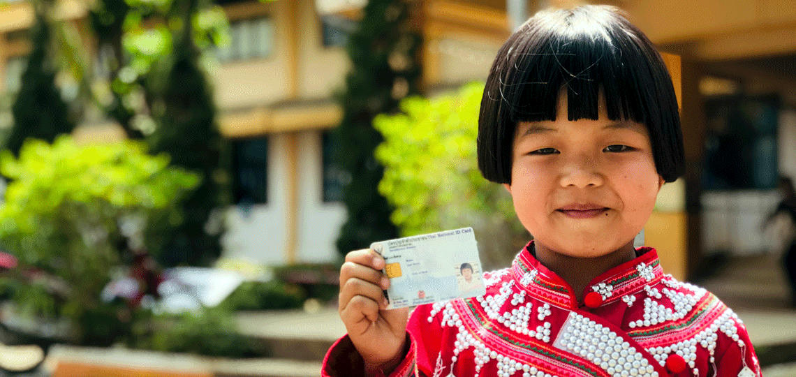 Girl showing her birth certificate, a form of ID required by many governments in order to vote 