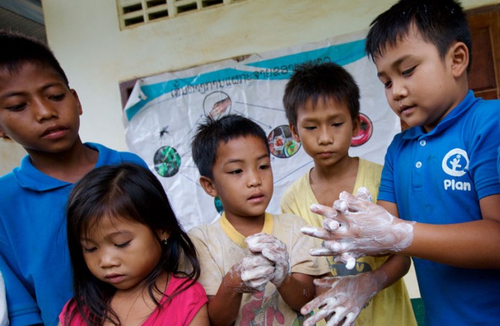 Children wash their hands