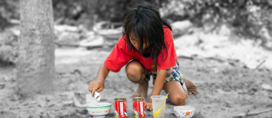 Prey, 8, playing her favorite game of pretend cooking. Photographer: Karolina Paatos.