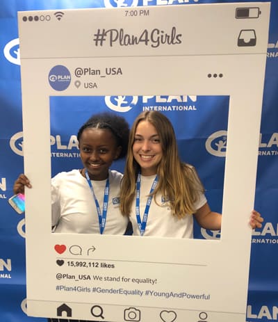 Bailey poses with a fellow youth leader with a social post photo prop at the Youth Leadership Academy in Washington, D.C.