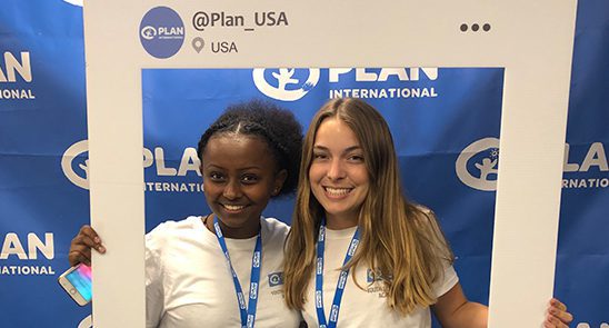 Bailey poses with a fellow youth leader with a social post photo prop at the Youth Leadership Academy in Washington, D.C.