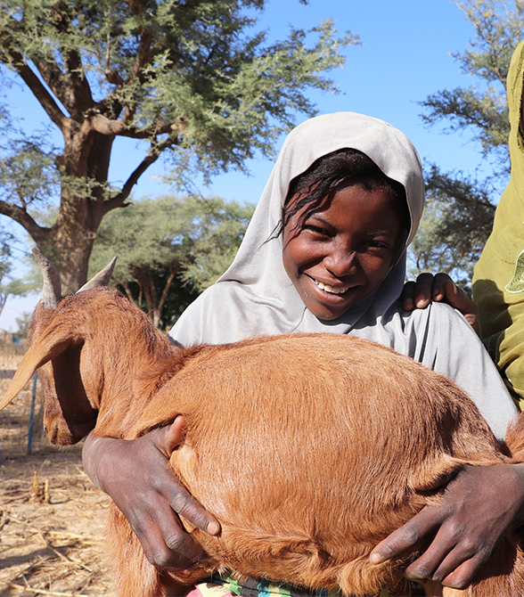 Girl Holding Goat