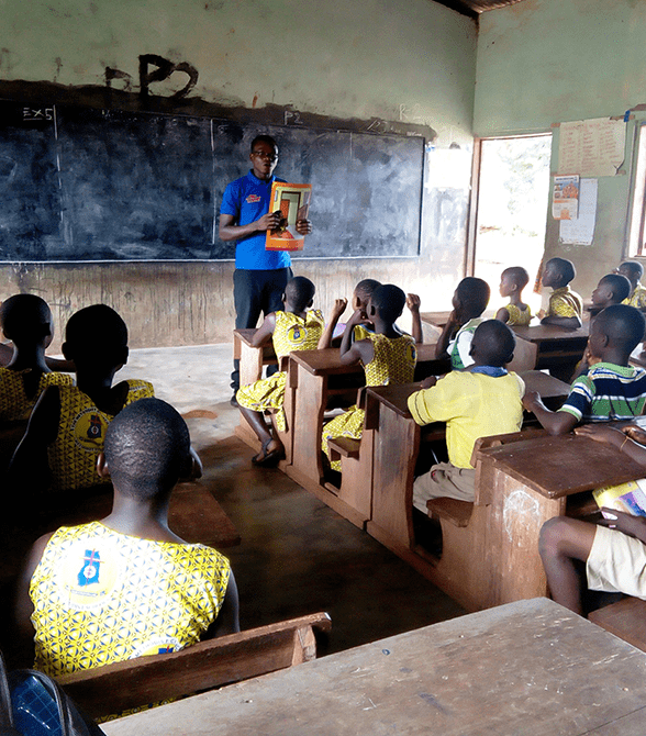Sponsored Child Presenting To Class In Ghana