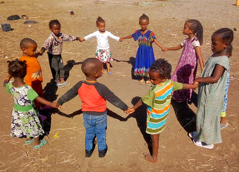 Children Holding Hands Playing