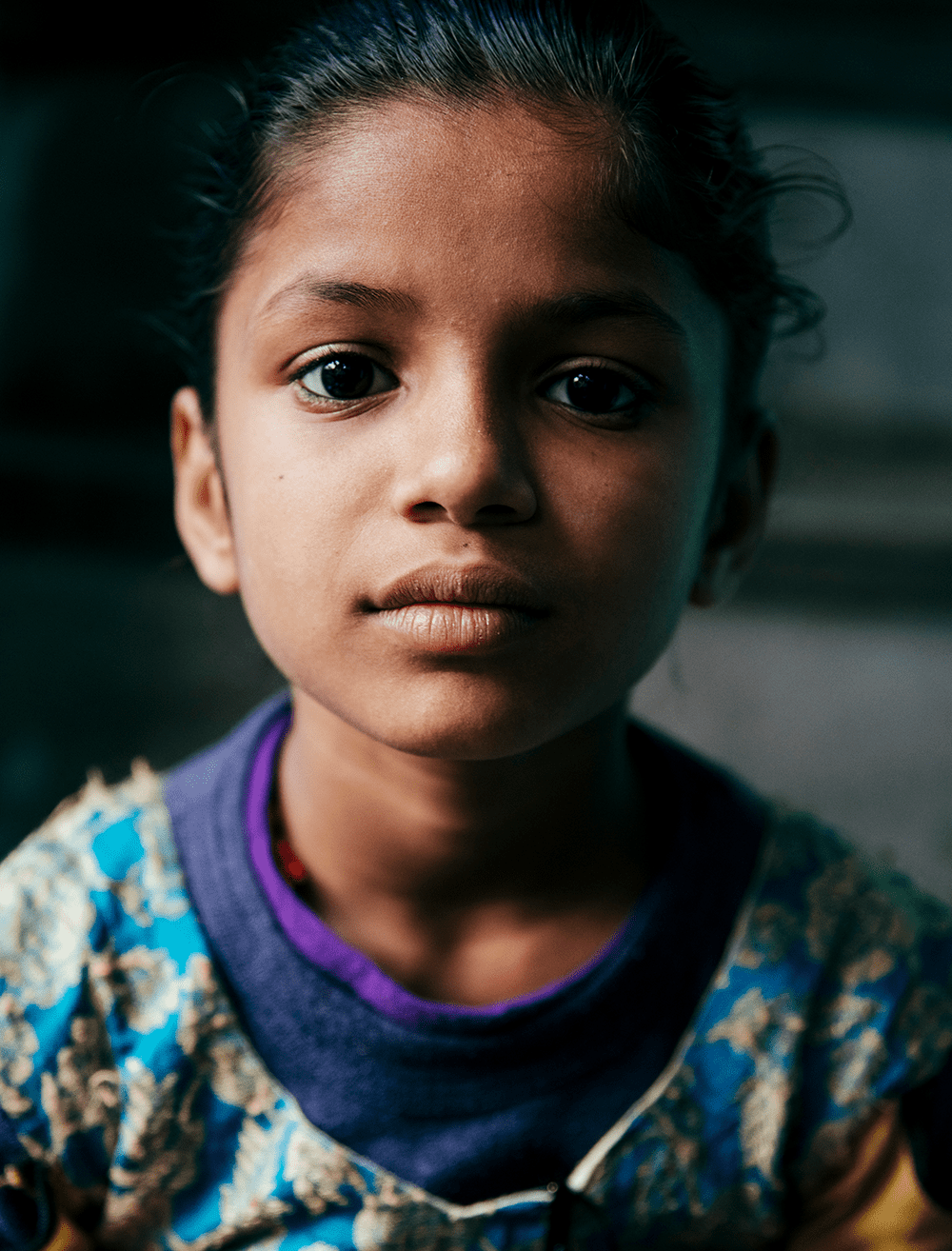 Priya, age 8, lives in Dehli, India, pictured here close up portrait
