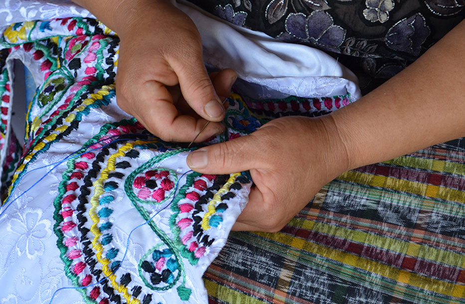 A woman does embroidering as a way to improve gender equality through funding in Guatemala