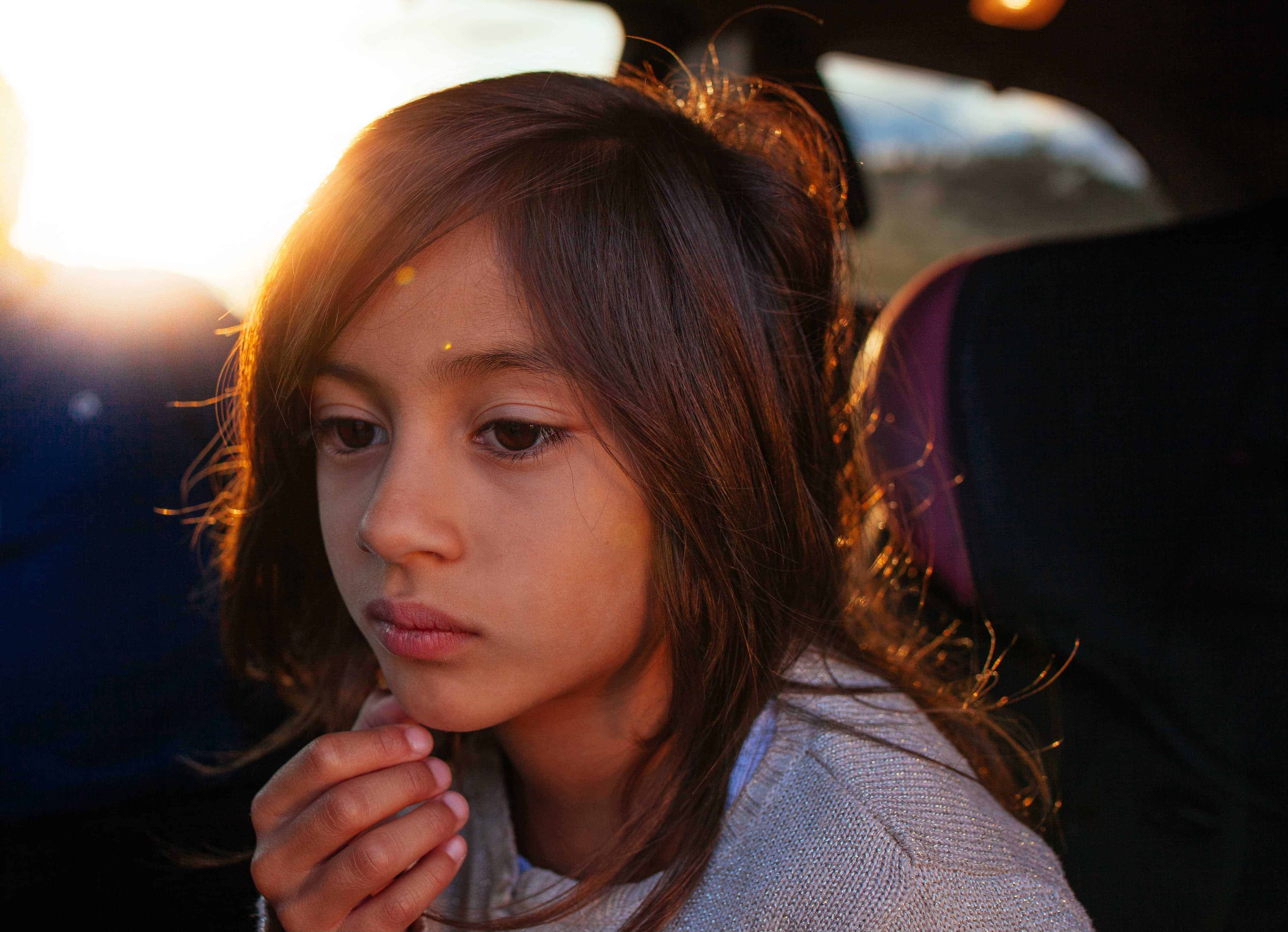 Portrait of a Central American migrant girl in a vehicle