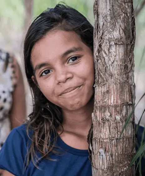Girl next to tree