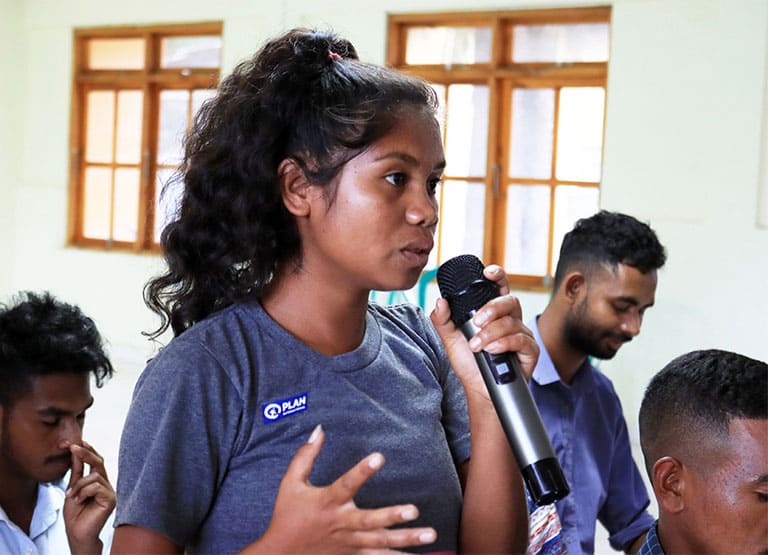 Plan worker speaks on a microphone