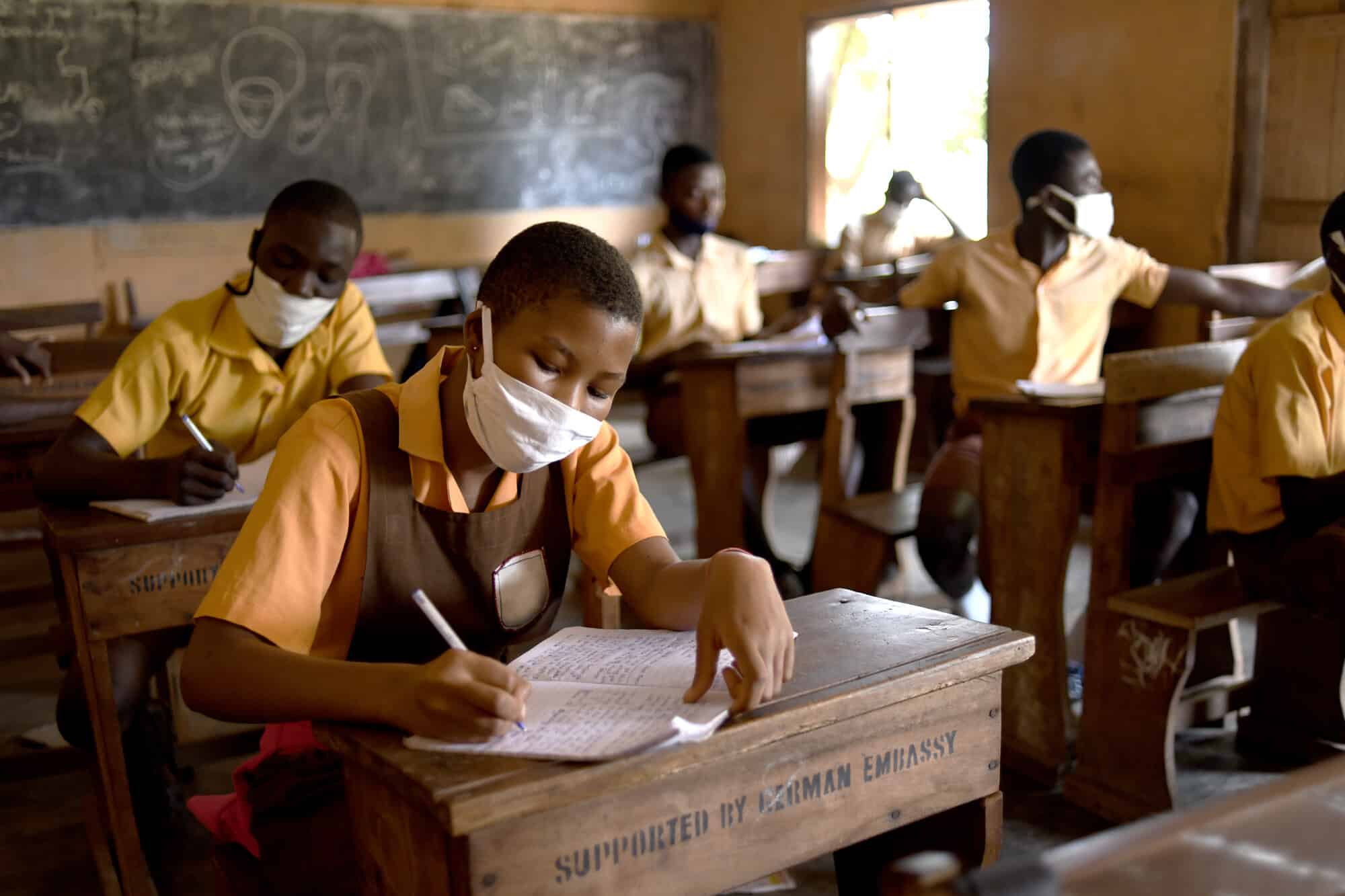 Girls in Ghana study in the classroom after their school was closed for eight months due to COVID-19.