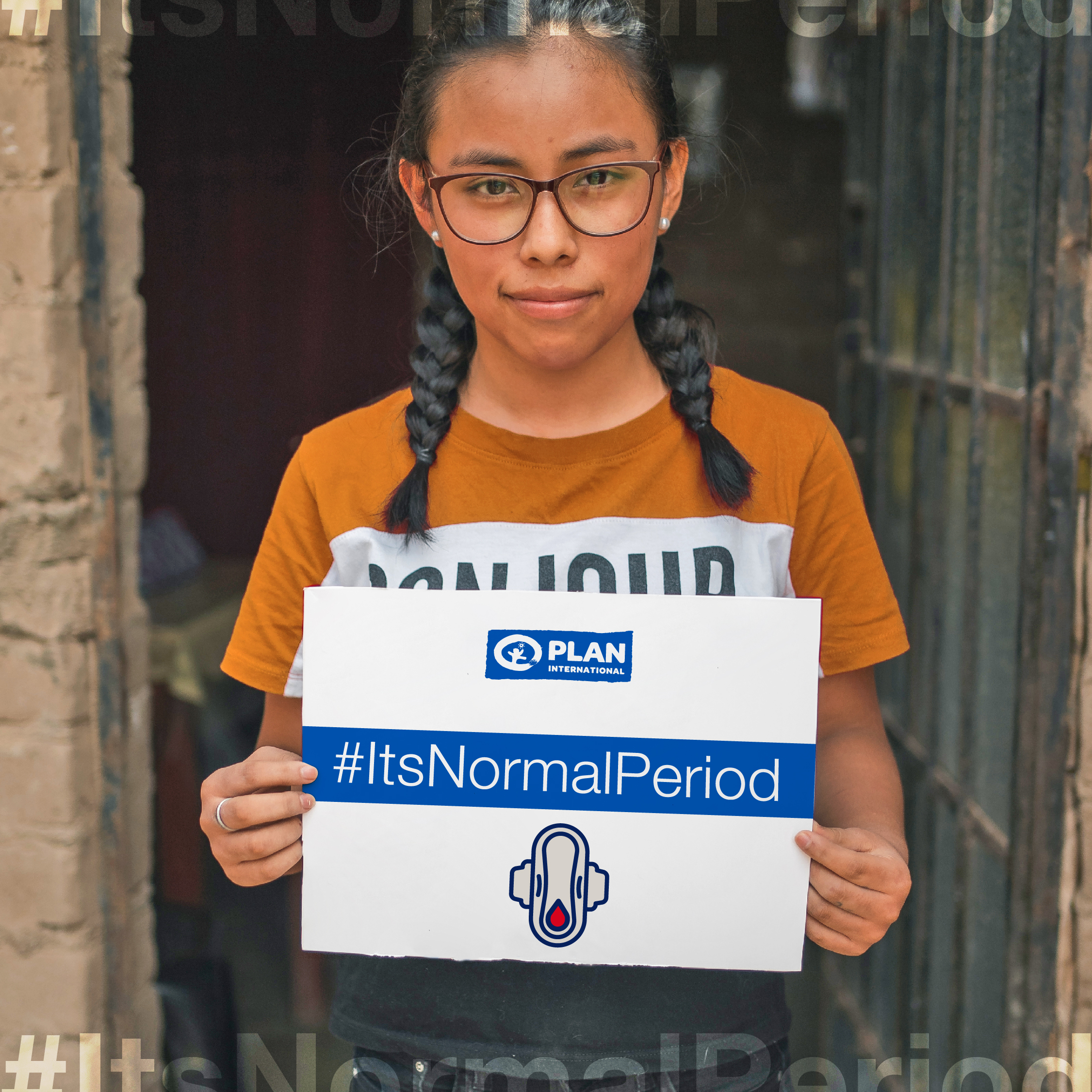 A young adolescent girl holds a sign that reads It's Normal Period advocating for menstrual health and attitudes