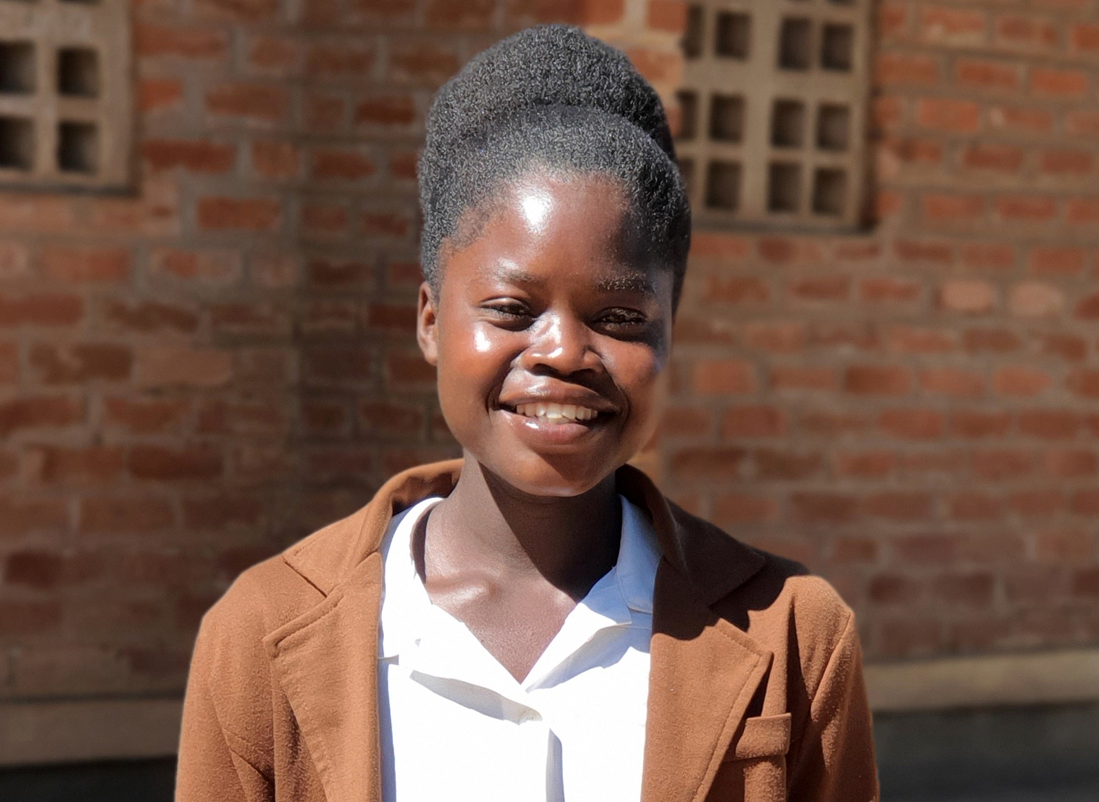 Esnart, an 18-year-old from Malawi, says that girls in her community are told to stay at home when they’re on their period.