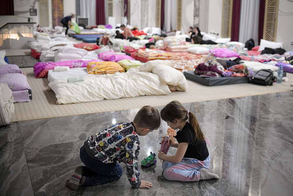 Ukrainian children playing together in a refugee center. 