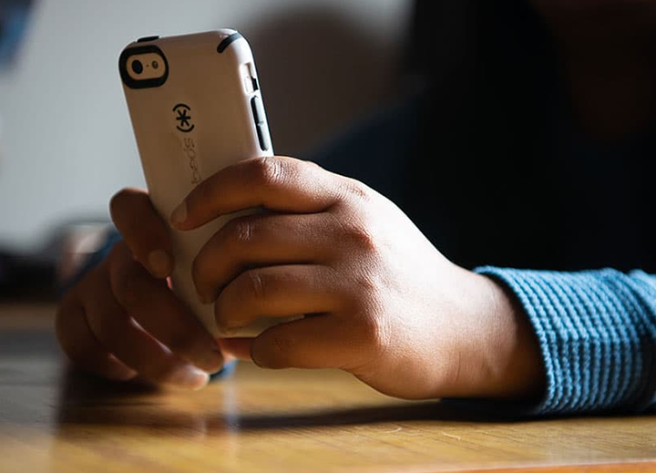 close-up of hands holding a smartphone