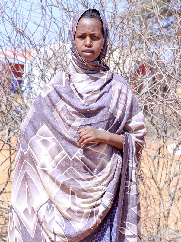 Faisa now lives in an internal displacement settlement with her family, after they were forced to flee their home in search of food and water. 