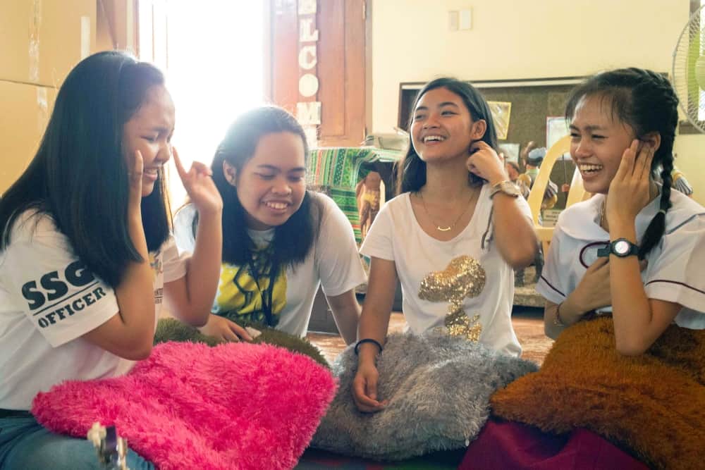 Tisay and her friends sit together to talk about their mental health.