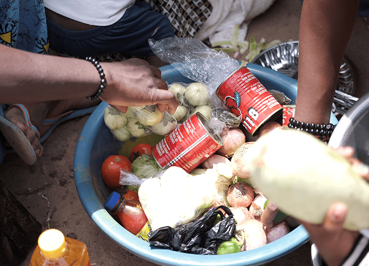Plan International responds to the hunger crisis by distributing food to families who need it.