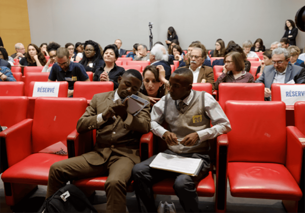 Kamanda, right, at the French senate in 2017. 