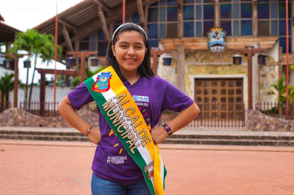 Yordana wears a sash designating her as the municipal mayor after her election.