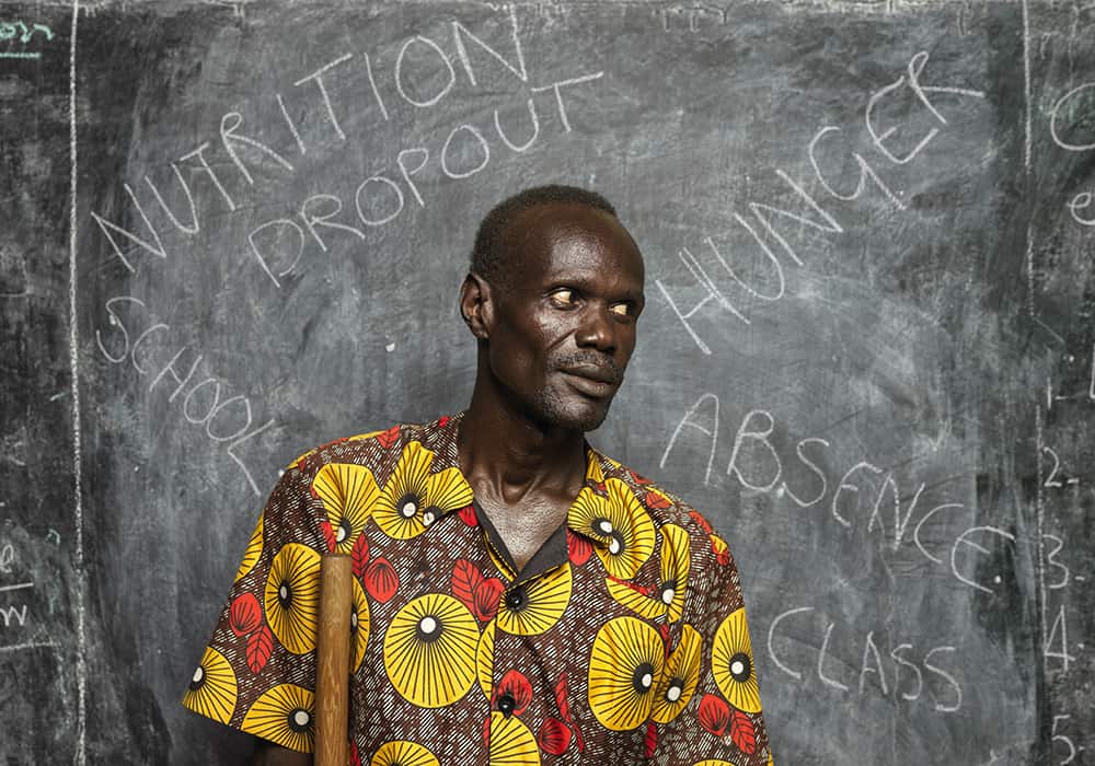 Clement has a mobility issue, but he doesn’t let his disability hold him back, and he advocates for the inclusion of all children with disabilities in the classroom. “I am disabled, not unable,” he says. “I always tell myself, ‘Clement, there is nothing you can’t do.’ That is what I teach to the children, although lately my aim is to keep the children in school during the food crisis.”