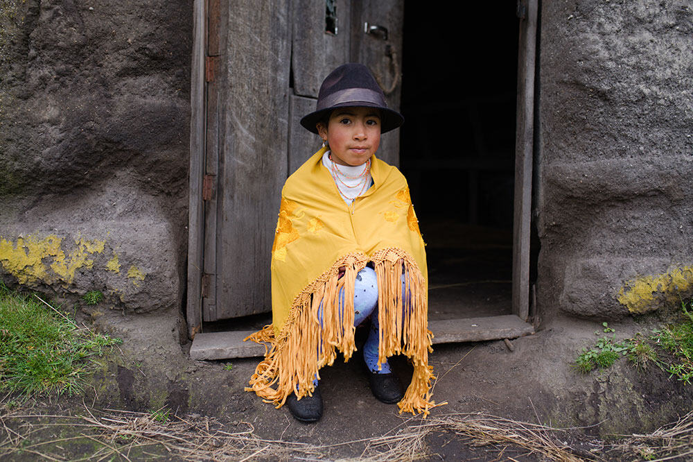 Katy, 9, outside of her home in the Andes.