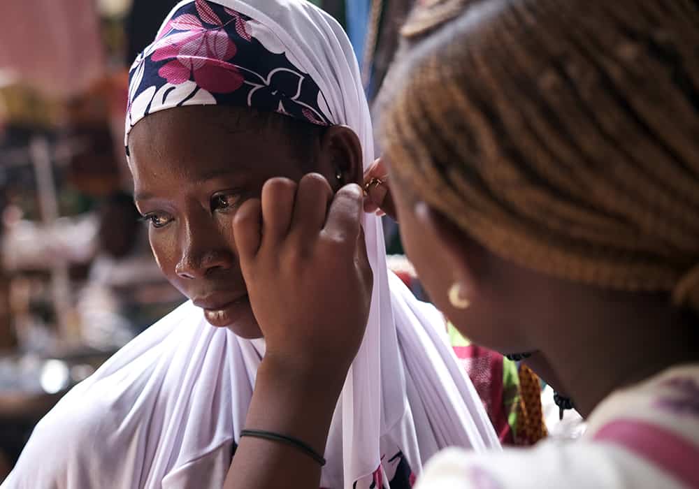Floriane buys a pair of earrings for her new friend. "If it were up to me, I would be with them every day and cook for them every day,” she says. 