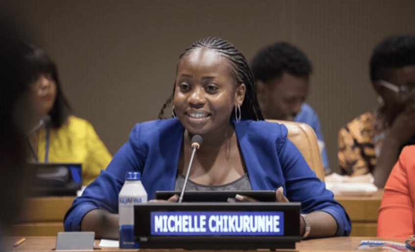Michelle speaking at the “Unlock the Future of Learning” event, using her voice to promote community-led development!
