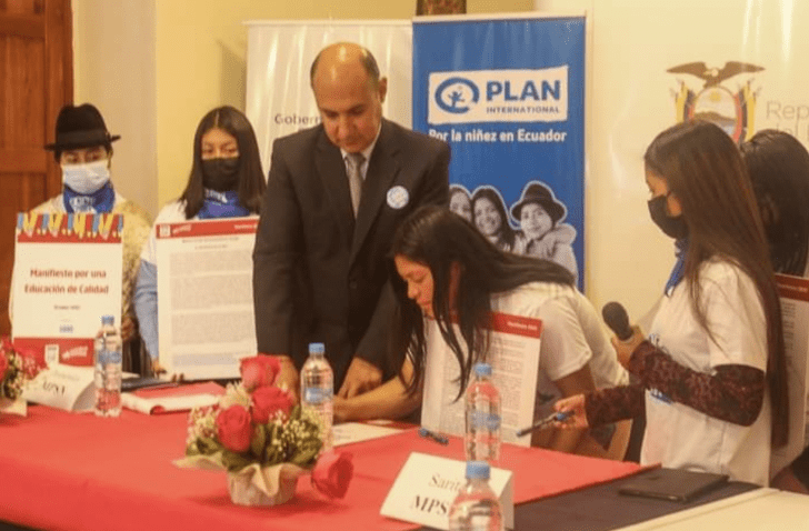Nataly and Wenddy working with local leaders and other young people to support education programs on International Day of the Girl. 