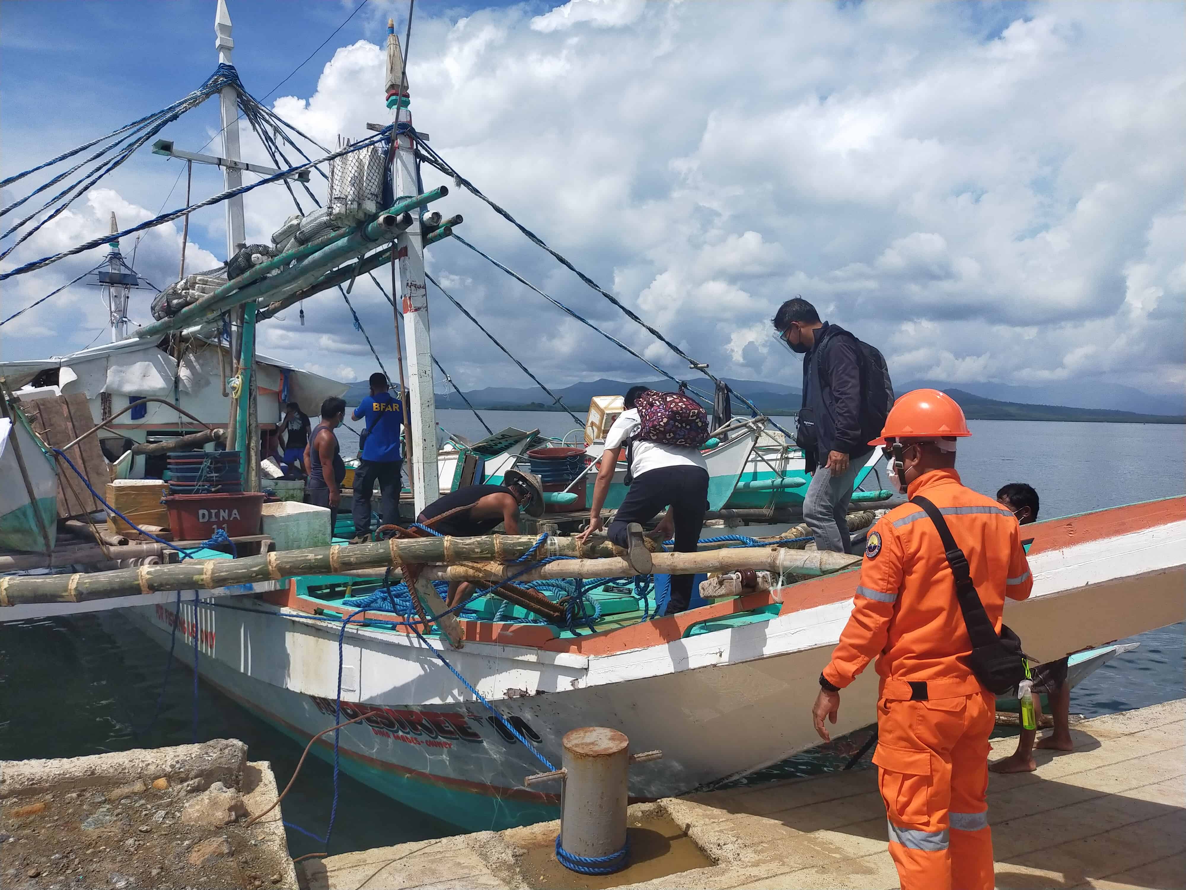 Inspectors on a fishing vessel.