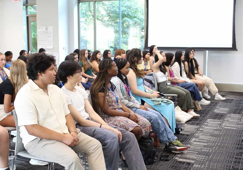 Young people watch a presentation during the in-person YLA sessions in D.C. 