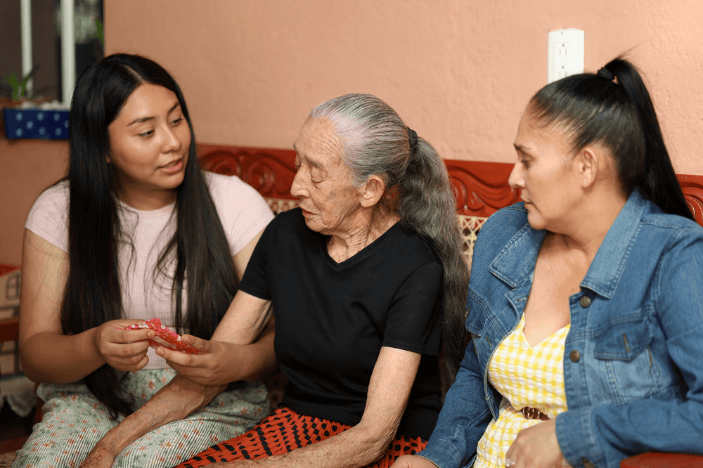 Hazel shows her grandmother how to use a pad.