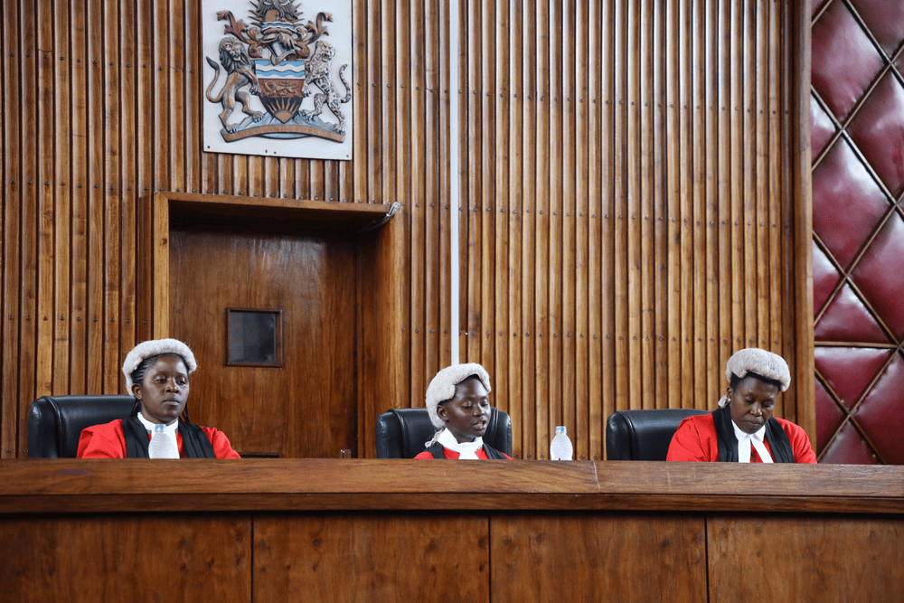 Three girls in court justice robes speak from the bench of Malawi's appeals court.