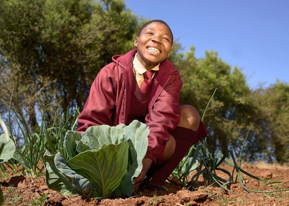 Lethubuhle, 15, tends to vegetables in her school’s garden. 
