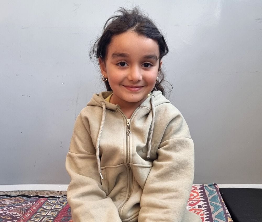 Eleen, 8, lives with her family in a school that has been converted to a shelter in Lebanon. 