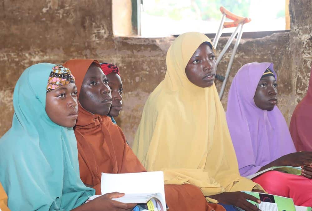 Girls listen to their teacher during class in Nigeria.