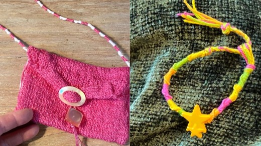 A small pink knitted purse sits on a wooden table: a yellow, pink and green cloth friendship bracelet is displayed against a green background.