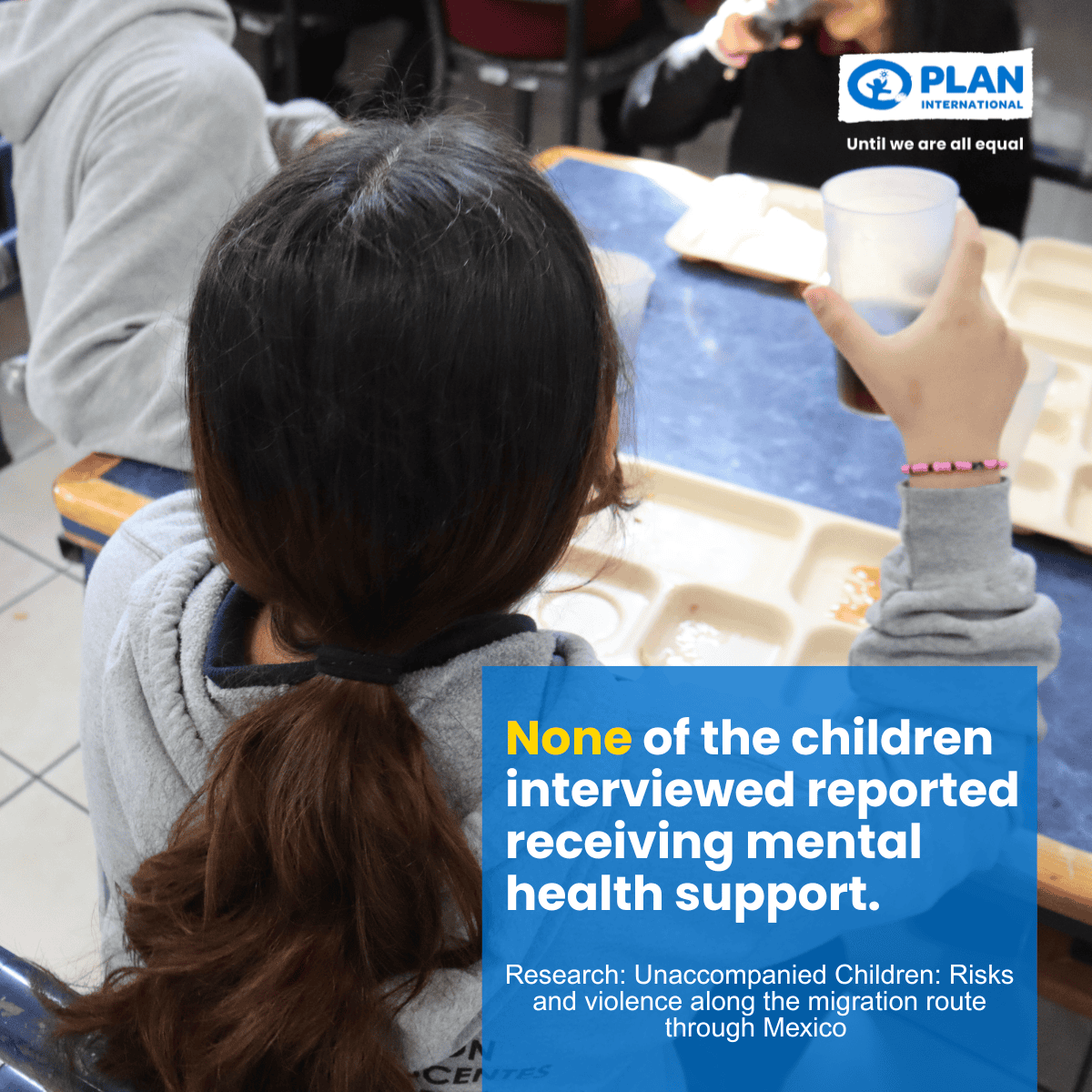 Child with a drink sitting at a lunch table. Text: 'None of the children interviewed reported receiving mental health support.'