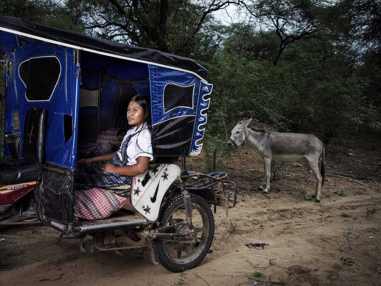 Yulitza sits on a motorbike used to travel to school in Peru